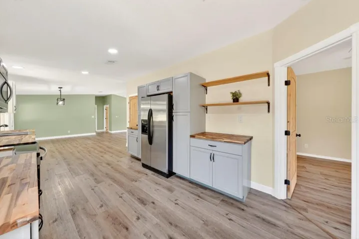 Kitchen - Look at the cabinets, BEAUTIFUL Counters, new fixtures and newer appliances and New Tile Backsplash!