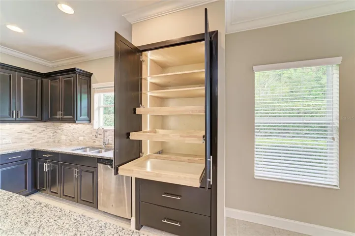 Pantry was converted to match the cabinets.  Pull out shelves and drawers with internal light