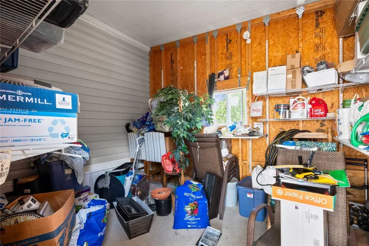 Storage shed is attached to carport.
