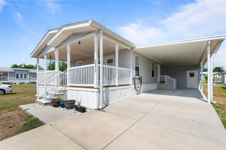 Wide carport on this newer home.