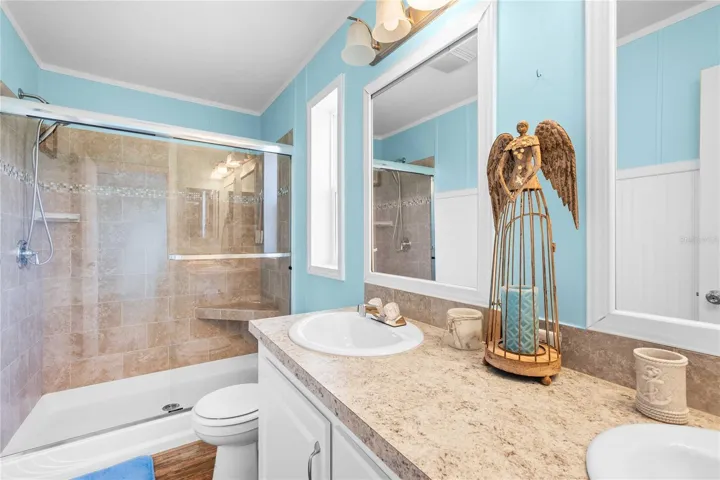 Incredible primary bathroom with custom step-in shower.
