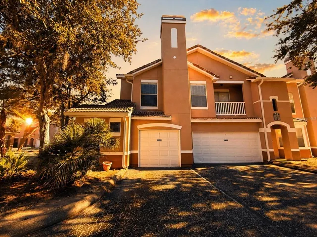 Front of property with garage and parking