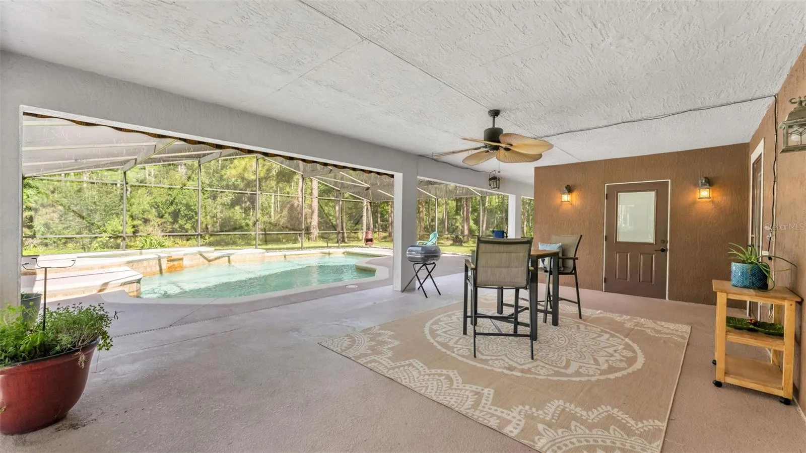Back patio towards pool and spa and full bath straight ahead to the R