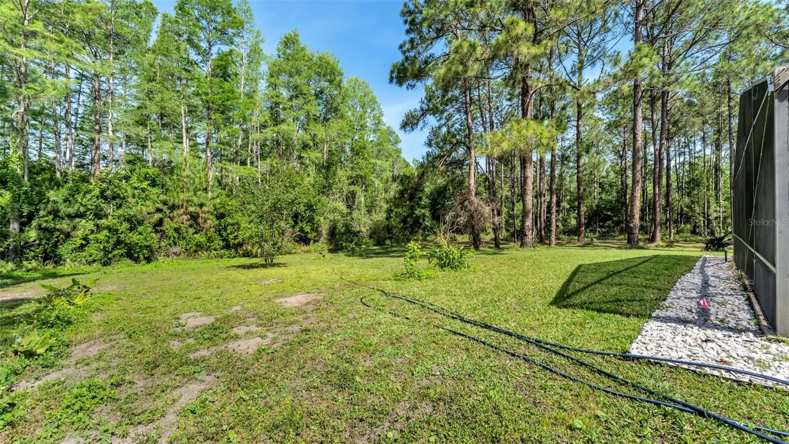 Back of property towards 2nd lot and wetlands area to the L