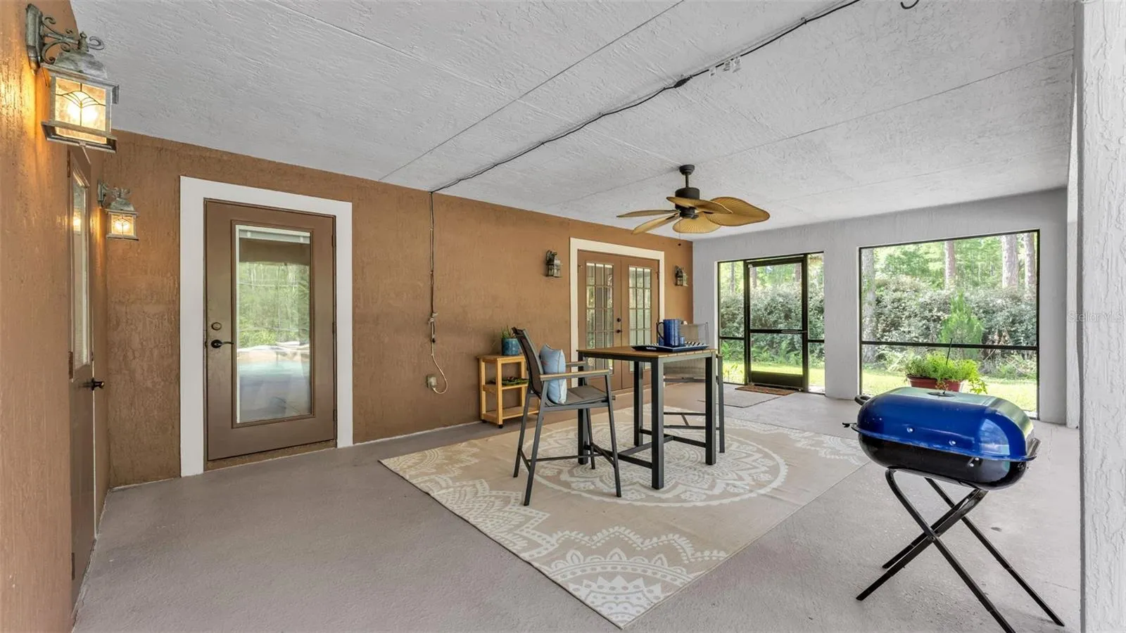 Patio from pool to inside doors and full bath to the L