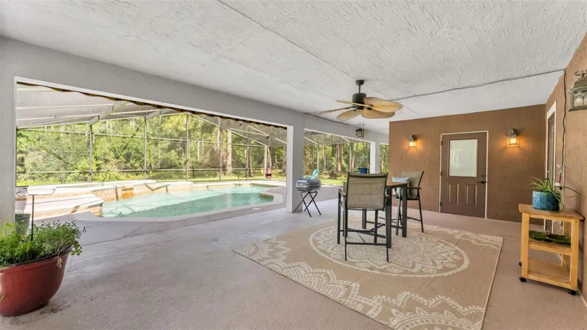 Back patio towards pool and spa and full bath straight ahead to the R