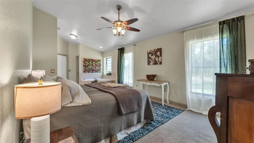 Primary bedroom towards bathroom and hot tub