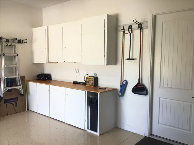 Garage Workspace with Cabinetry and Storage.