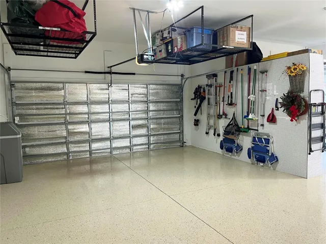 4-Foot Extended 3-Car Garage Featuring Epoxy Flooring and Extensive Storage, Including, Overhead Storage Racks