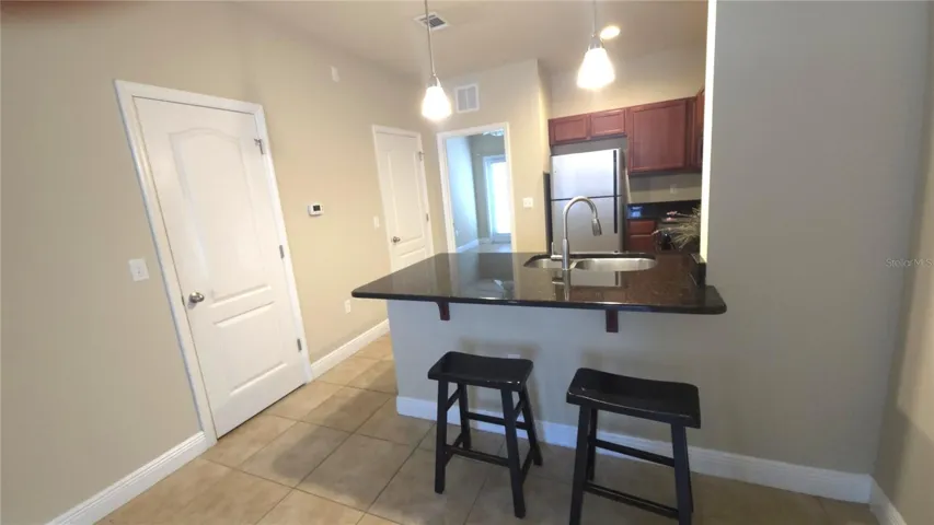 Kitchen with pantry and storage room
