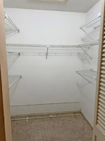 Primary Bedroom Walk In Closet