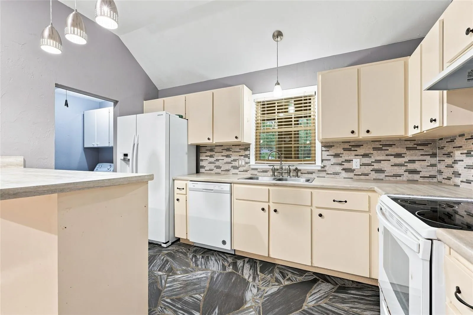 kitchen with view of laundry room