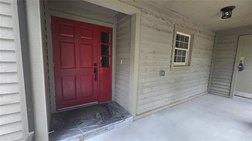 Entry Screened room - storage room to right