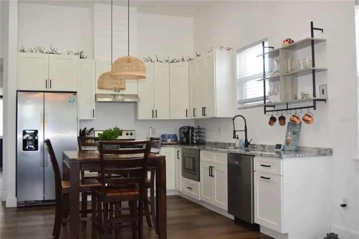 Kitchen is bright and inviting with quality wood cabinets