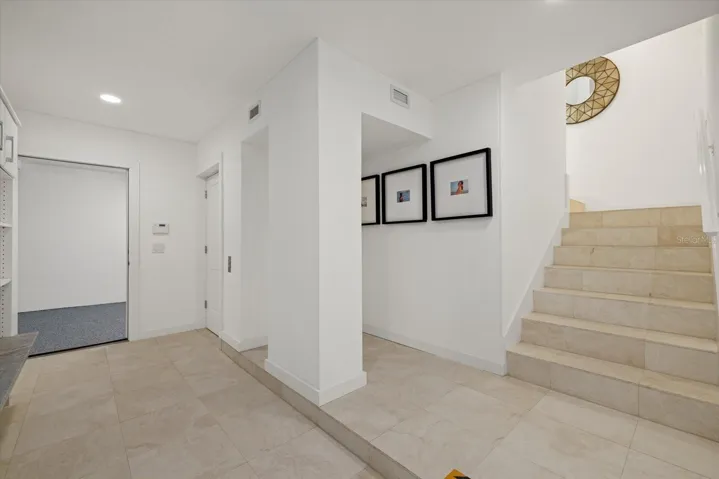 Mudroom off garage on 1st level with access to elevator