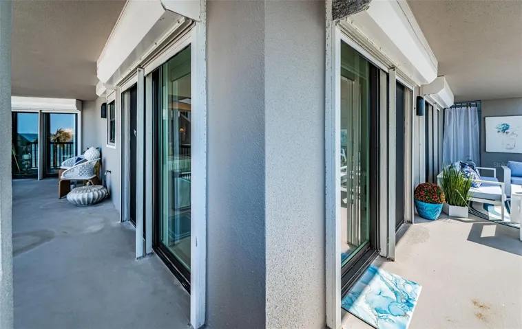 The balcony stretches around to connect the second bedroom with access and additional storage for your beach things!