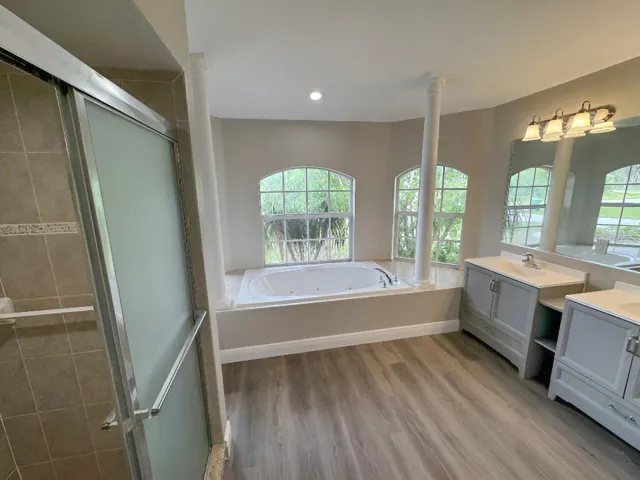 1ST PRIMARY BEDROOM EN SUITE BATH WITH DUAL VANITIES, JETTED TUB AND SEPARATE SHOWER