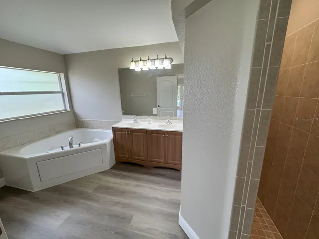 2ND PRIMARY BEDROOM EN SUITE BATH WITH ROMAN SHOWER, SEPARATE TUB AND DUAL SINKS