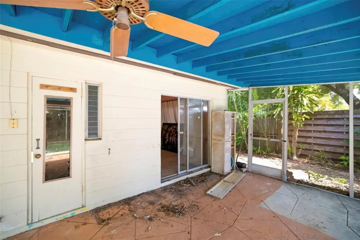 Sliders leading to family room and door to pool bathroom.