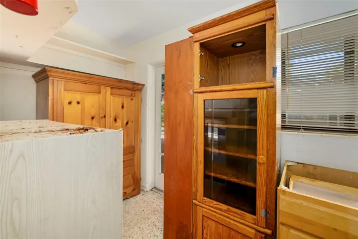 Utility room with lots of storage space and direct access to patio/pool.