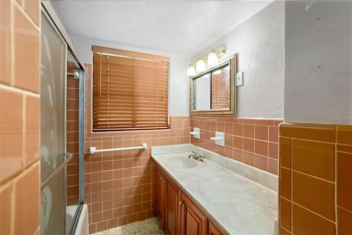 Primary bathroom featuring shower and tub