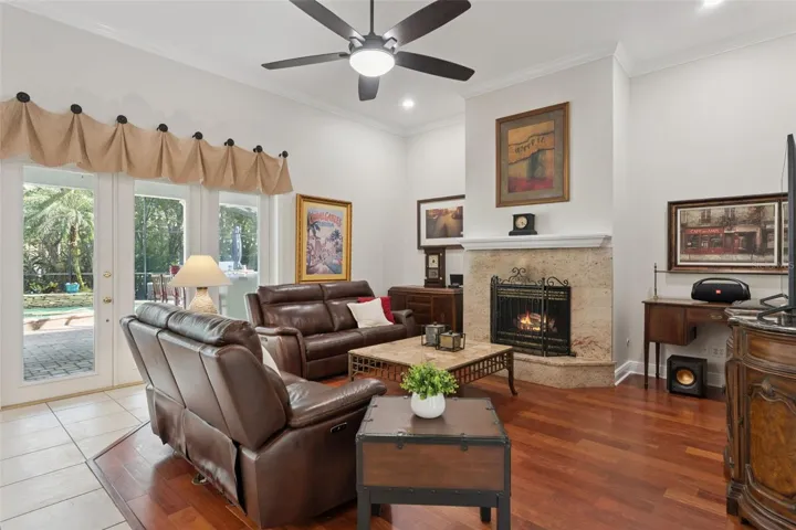 Spacious living area with volume ceilings and gas fireplace