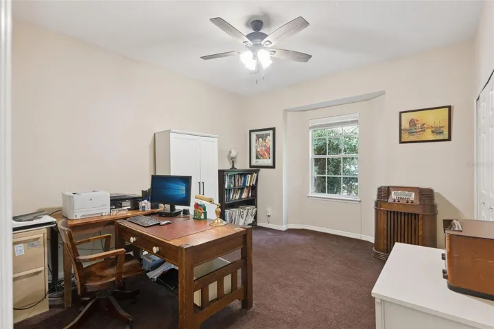 Spacious secondary bedroom currently used as a home office