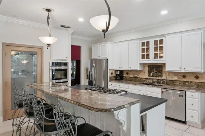 Spacious kitchen with gas stove top and recessed vent