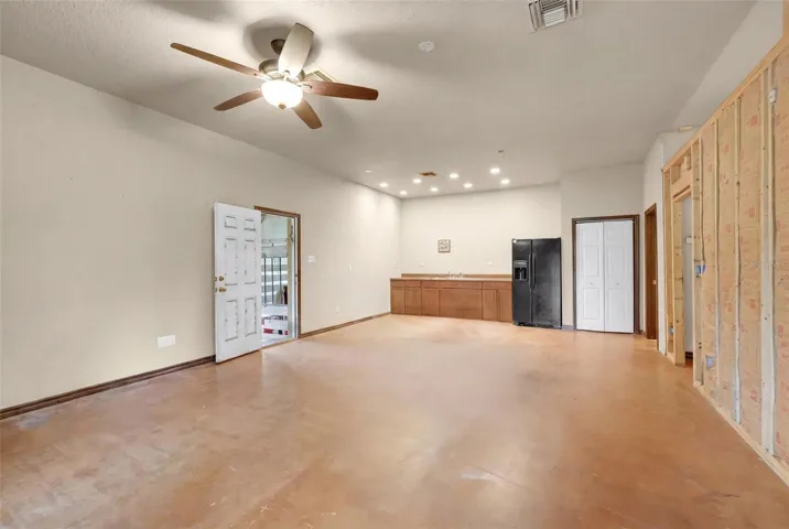 Spacious apartment living area offers endless flexibility, with direct access to the horse barn stalls for added convenience and functionality.