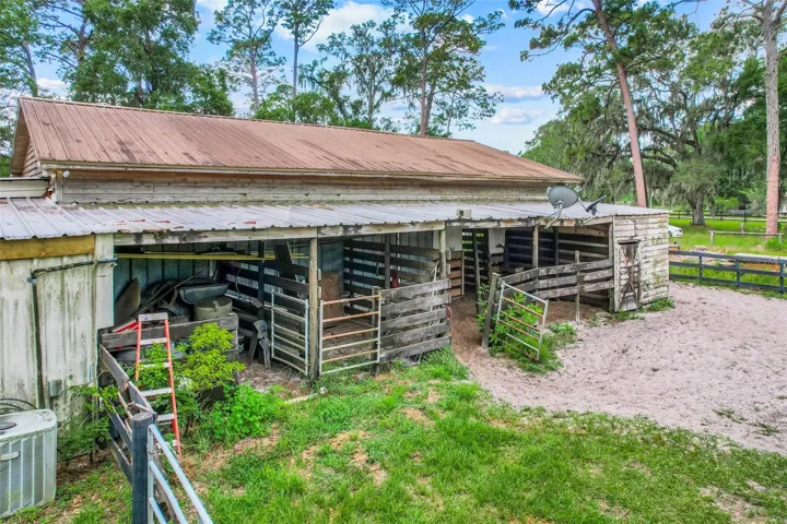 Functional horse barn design offers convenient stall access and thoughtful equestrian setup for boarding, training, or personal use.