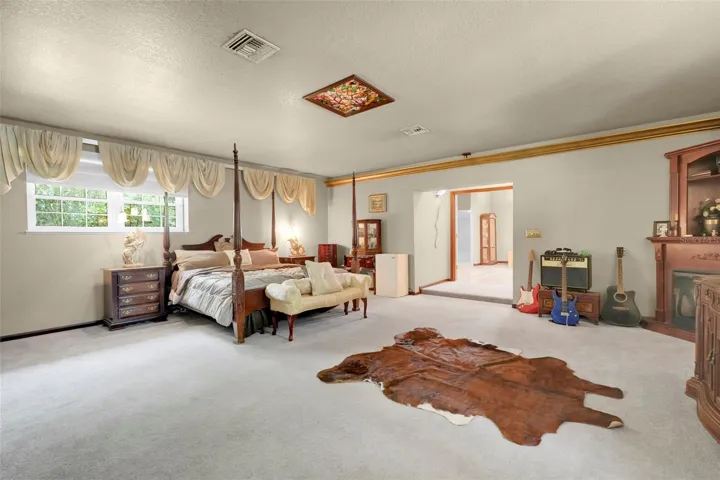 Expansive 24'9" x 22'4" Primary Suite offers exceptional flexibility with ample room for a sitting area, reading nook, or personal retreat.