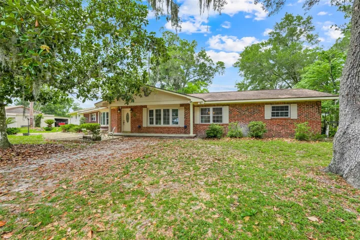 Nestled beneath mature shade trees, this property offers privacy, space, and endless possibilities.