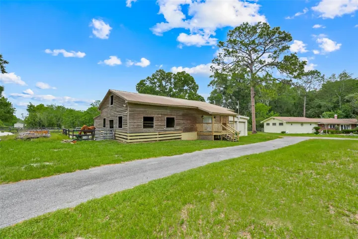Horse barn with attached 2-bedroom apartment offers endless possibilities for guests, caretakers, multigenerational living, or flexible use space.