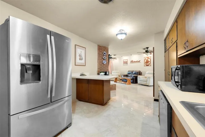 Kitchen offers convenient flow into the adjoining family room for everyday living and entertaining.