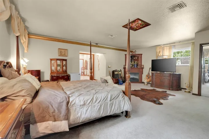 Oversized Primary Suite offering impressive scale and seamless transition toward the private ensuite retreat.