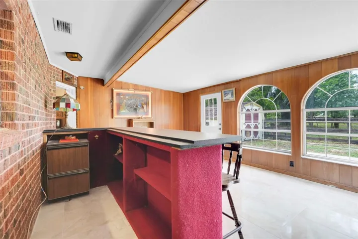 Bonus/Flex space featuring built-in bar, expansive windows, and endless possibilities for entertaining.
