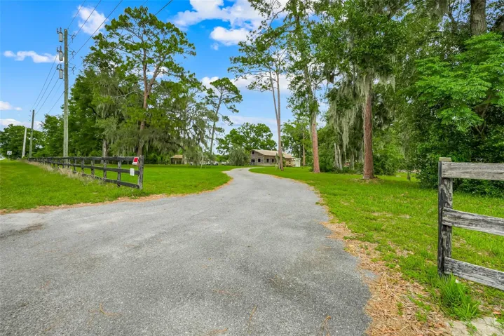 Secondary driveway access off SE 47th Ave. provides convenient access to the horse barn with attached apartment as well as the main house.