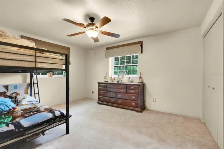 Bedroom 3 offers comfortable space, natural light, and closet storage.