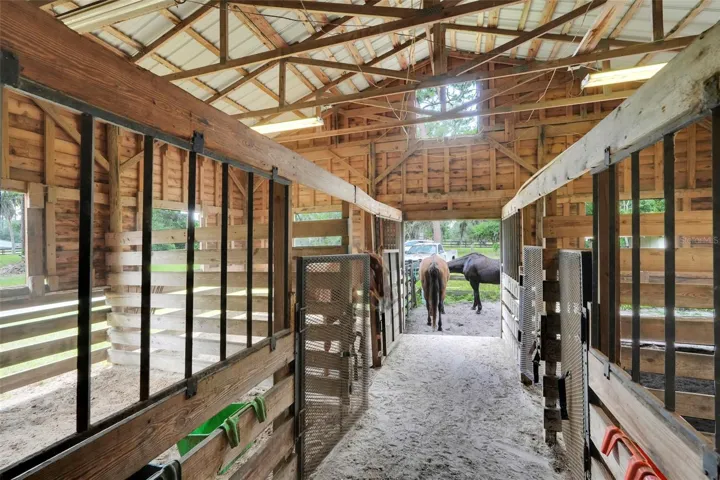 Unique setup offers direct access from the attached 2-bedroom apartment into the 8-stall horse barn — ideal for equestrian living and daily barn management.
