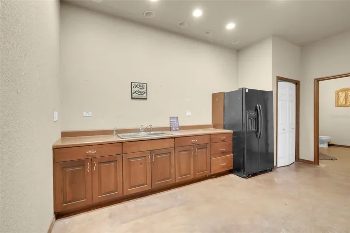 Apartment kitchen features ample cabinet storage and functional workspace, designed for comfortable everyday living.