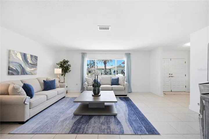 large picture window in living room brings in lots of natural light