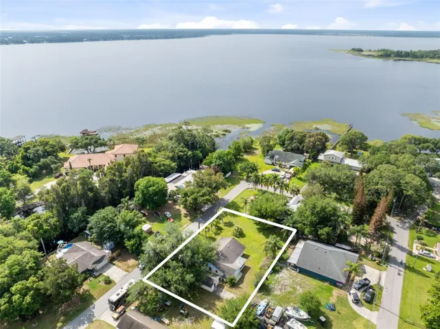 Home faces the street with views of Alligator Lake!