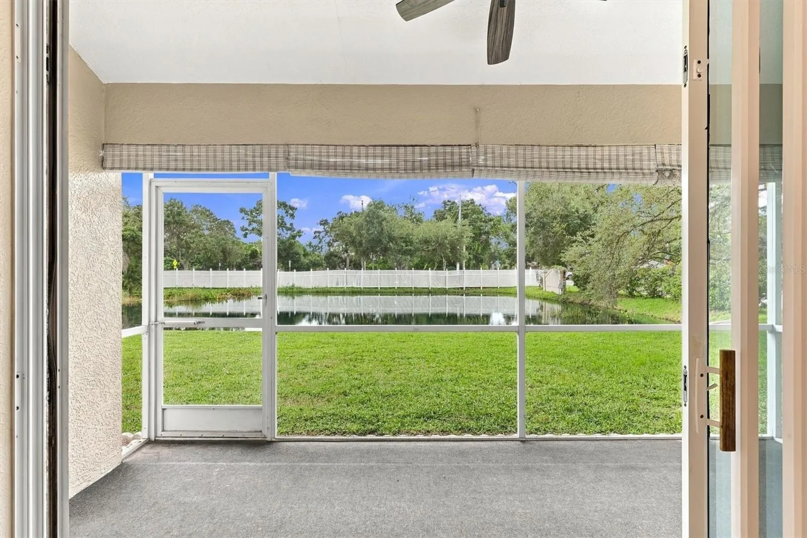 Screened lanai overlooking the pond
