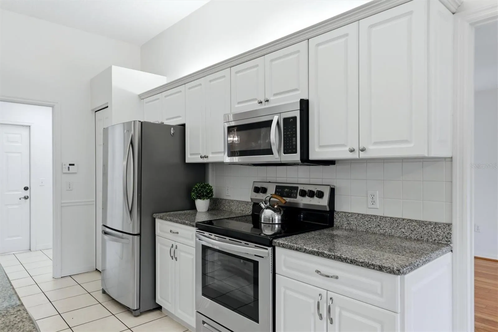 Kitchen with granite countertops, closet pantry