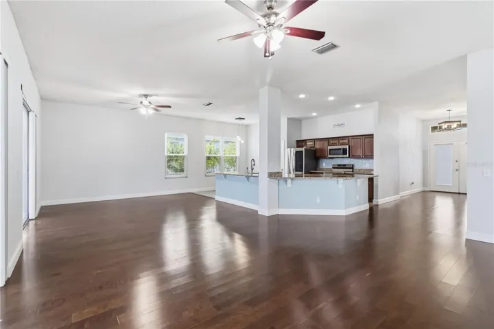 Living and dining area with warm wood floors