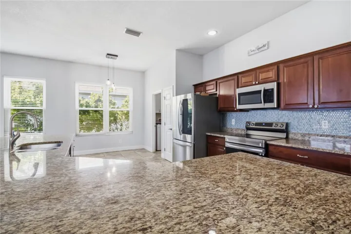 Kitchen with granite countertops and stainless appliances