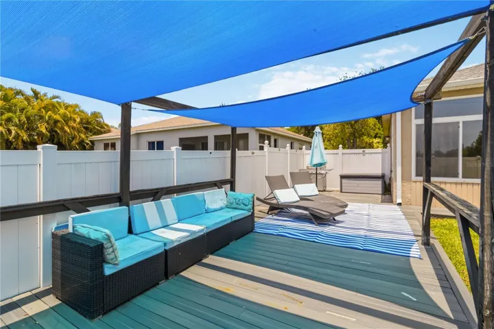 Shaded backyard deck with lounge space
