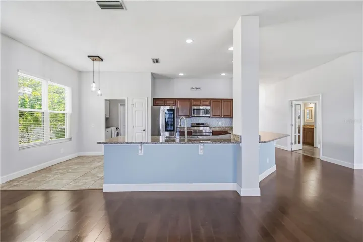 Open concept living area with high ceilings