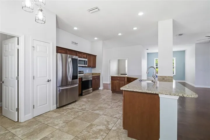 Kitchen flowing into dining and living areas
