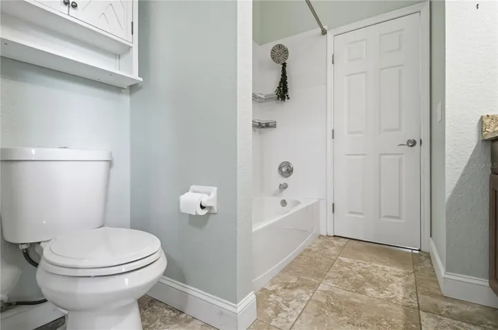 Guest bathroom with tub and shower